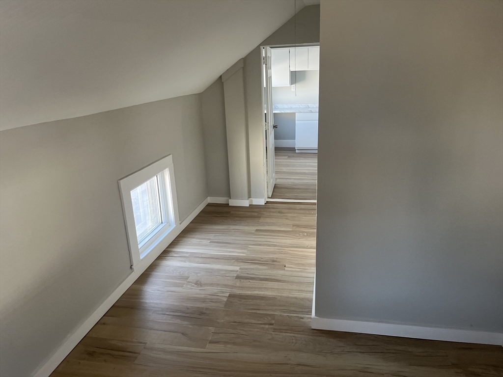 159 East Central Street, Unit 2 Franklin, MA 02038 - Photo 4 of 28 a view of a hallway with wooden floor