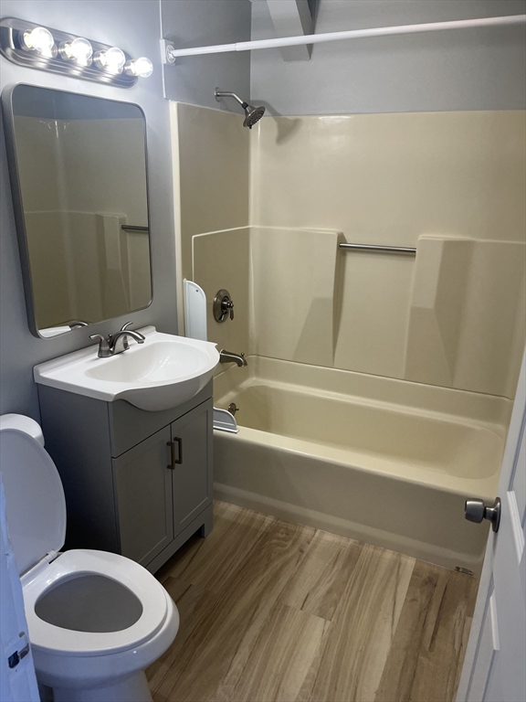 159 East Central Street, Unit 2 Franklin, MA 02038 - Photo 10 of 28 a bathroom with a sink toilet vanity and shower