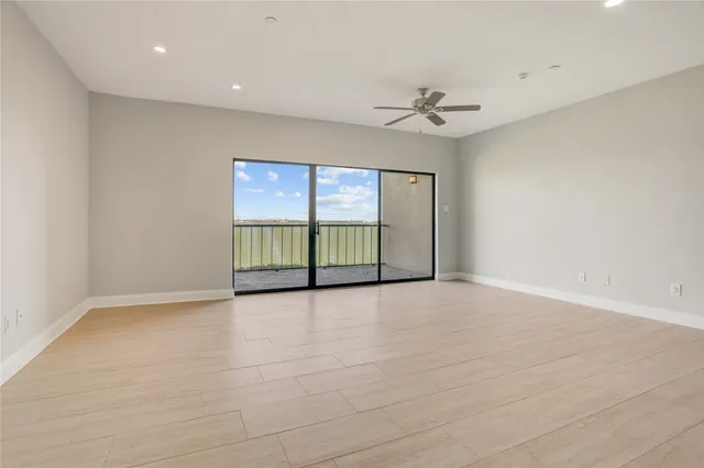 a view of kitchen with stainless steel appliances cabinets