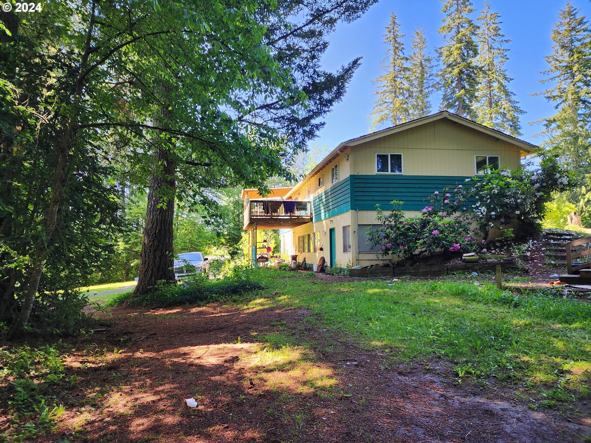 24361 South Upper Highland Road Colton, OR 97017 - Photo 12 of 47 a front view of a house with garden