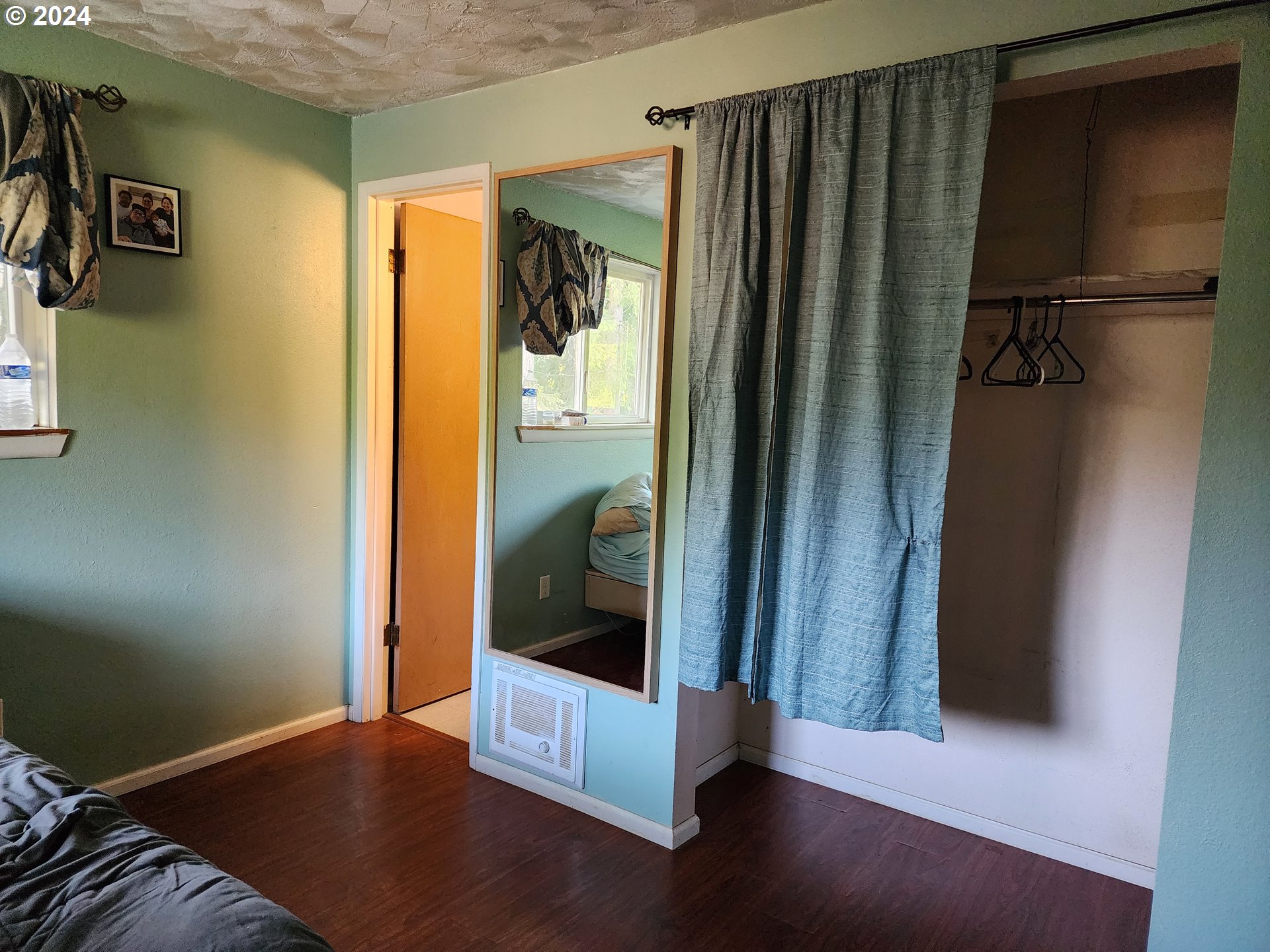 24361 South Upper Highland Road Colton, OR 97017 - Photo 5 of 47 a view of a hallway with wooden floor and closet