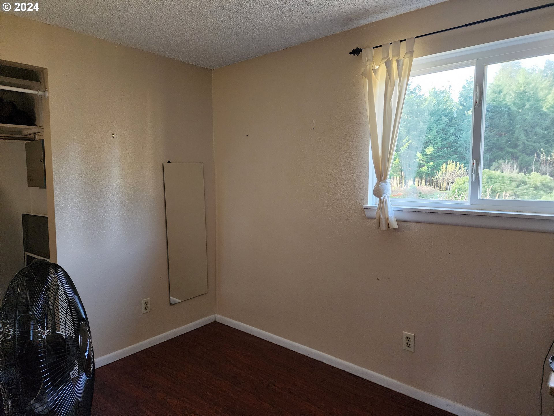 24361 South Upper Highland Road Colton, OR 97017 - Photo 7 of 47 a view of a room with wooden floor and a window