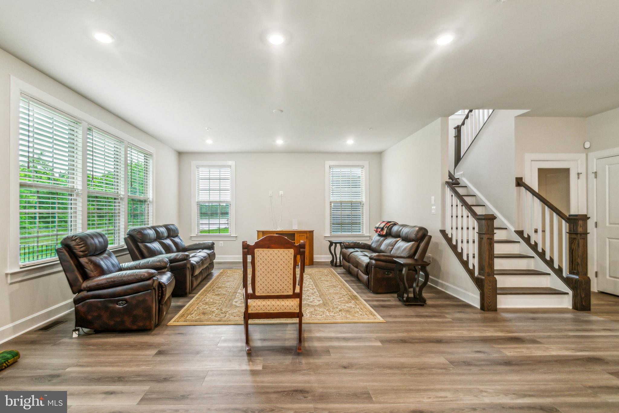 6536 Clubhouse Drive Laurel, MD 20708 - Photo 17 of 40 a living room with furniture and a floor to ceiling window