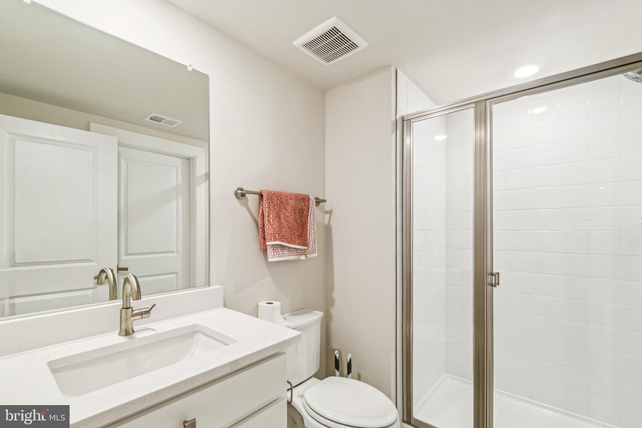 6536 Clubhouse Drive Laurel, MD 20708 - Photo 36 of 40 a bathroom with a sink toilet and shower