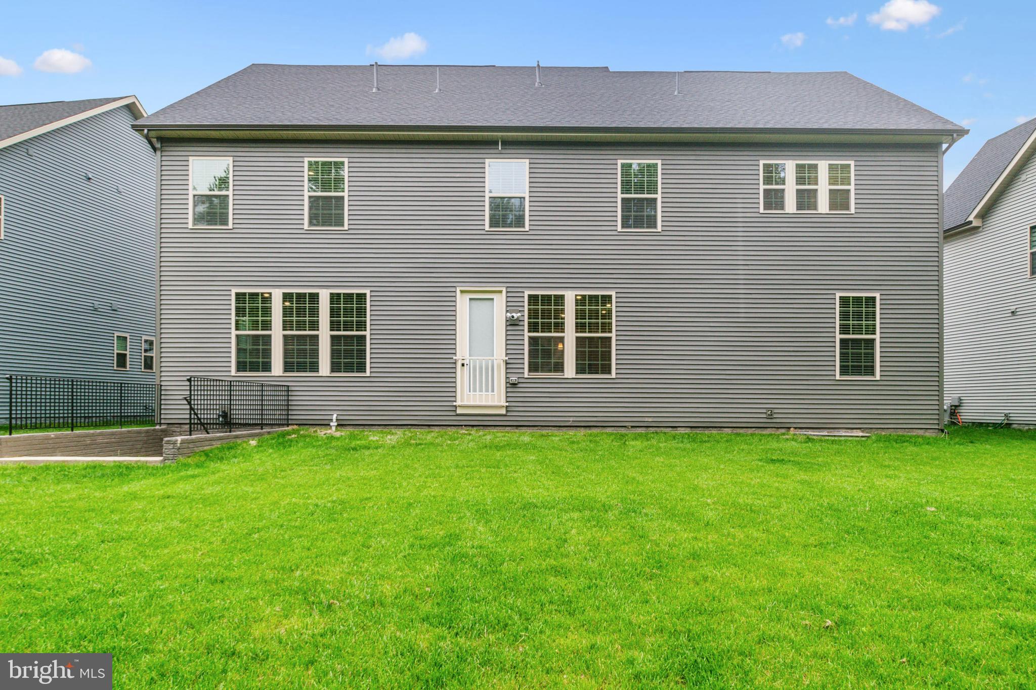 6536 Clubhouse Drive Laurel, MD 20708 - Photo 40 of 40 a front view of a house with a garden