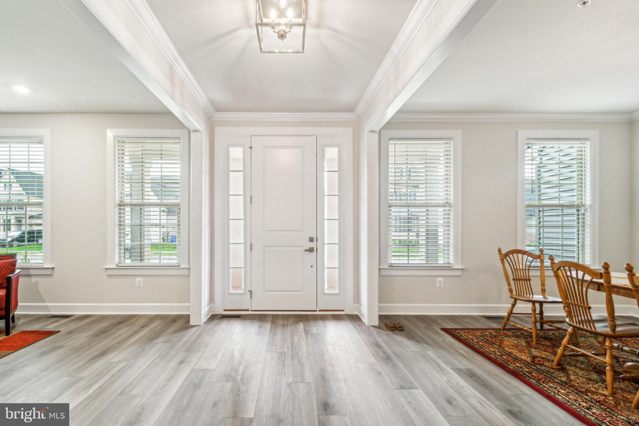 6536 Clubhouse Drive Laurel, MD 20708 - Photo 6 of 40 an empty room with wooden floor and windows