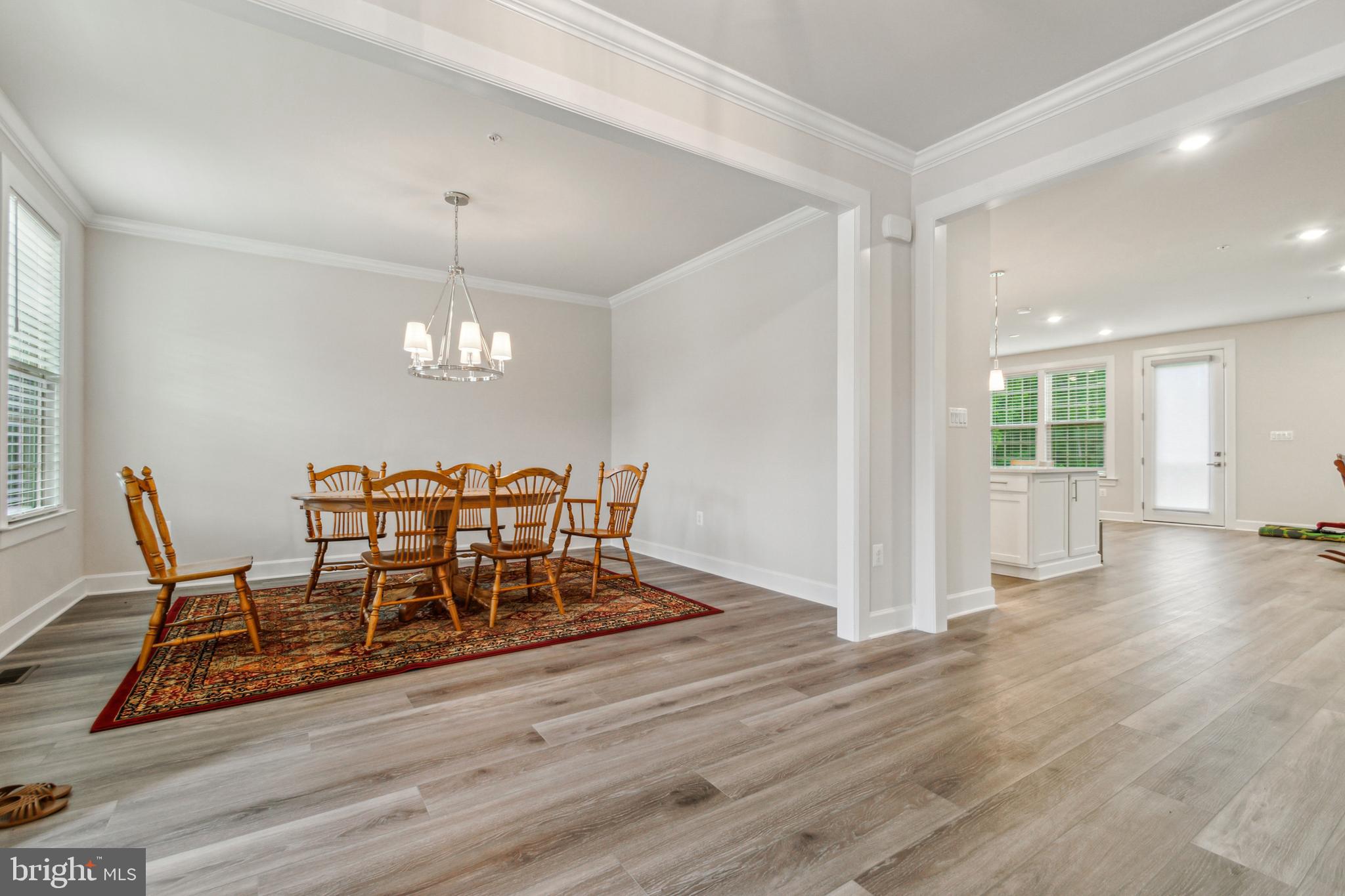 6536 Clubhouse Drive Laurel, MD 20708 - Photo 8 of 40 a view of a dining room with furniture and wooden floor