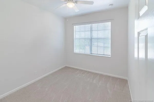 a view of a city with lush green forest