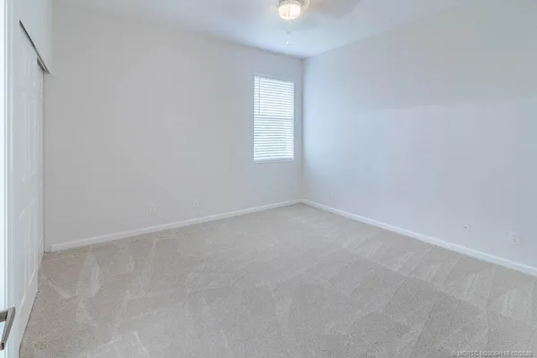 an aerial view of a house with a garden and swimming pool
