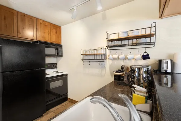 a view of kitchen and dining room with furniture