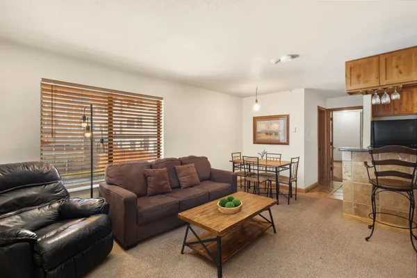 a living room with furniture and a window