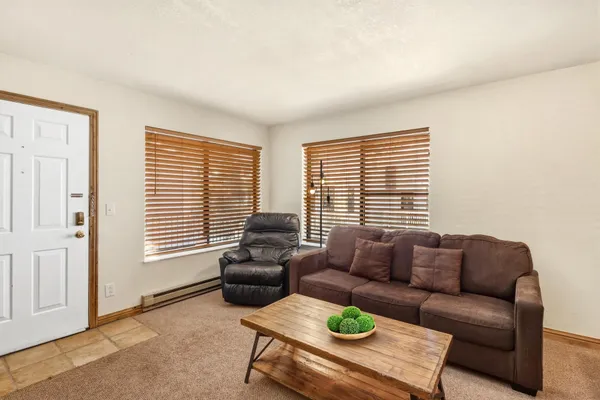 a living room with furniture and a window