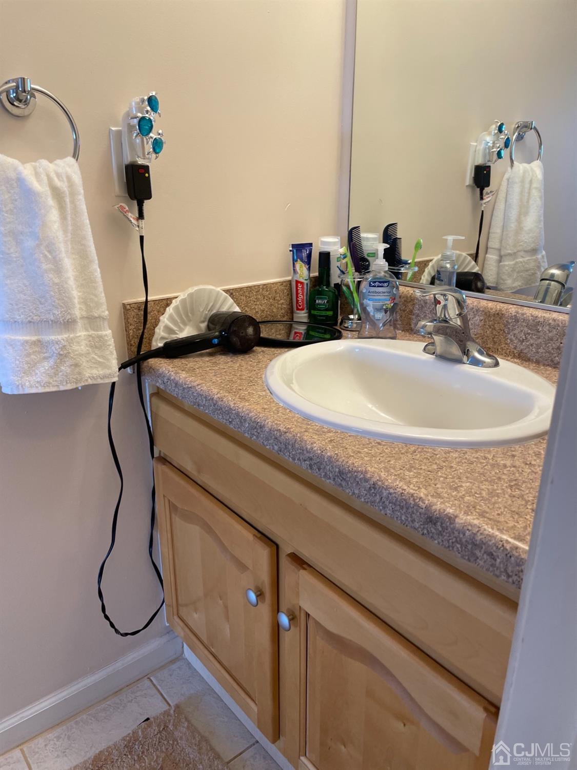 1124 Edpas Road New Brunswick, NJ 08901 - Photo 11 of 24 a bathroom with a sink and mirror