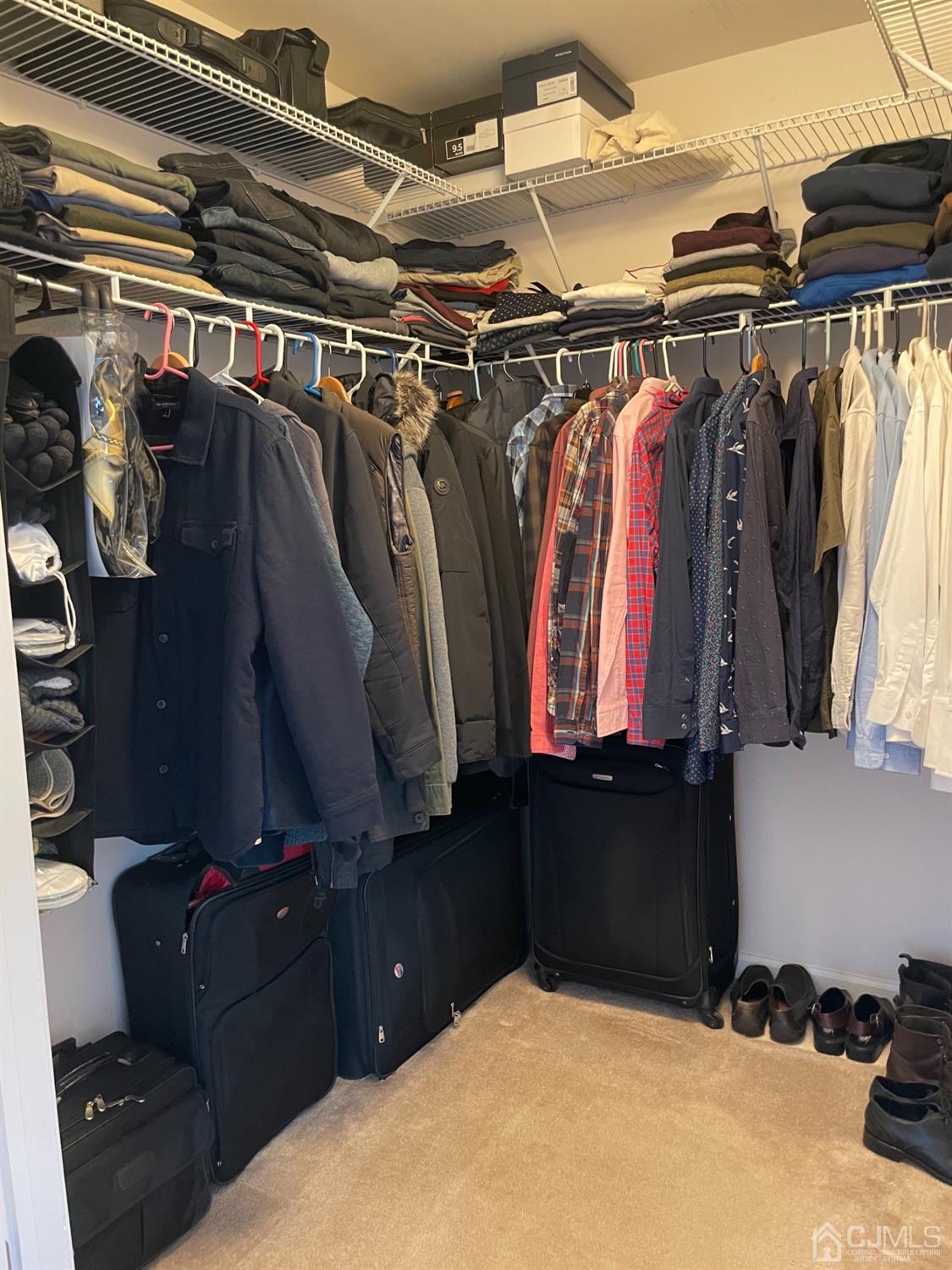1124 Edpas Road New Brunswick, NJ 08901 - Photo 13 of 24 a view of walk in closet with clothes and shoes