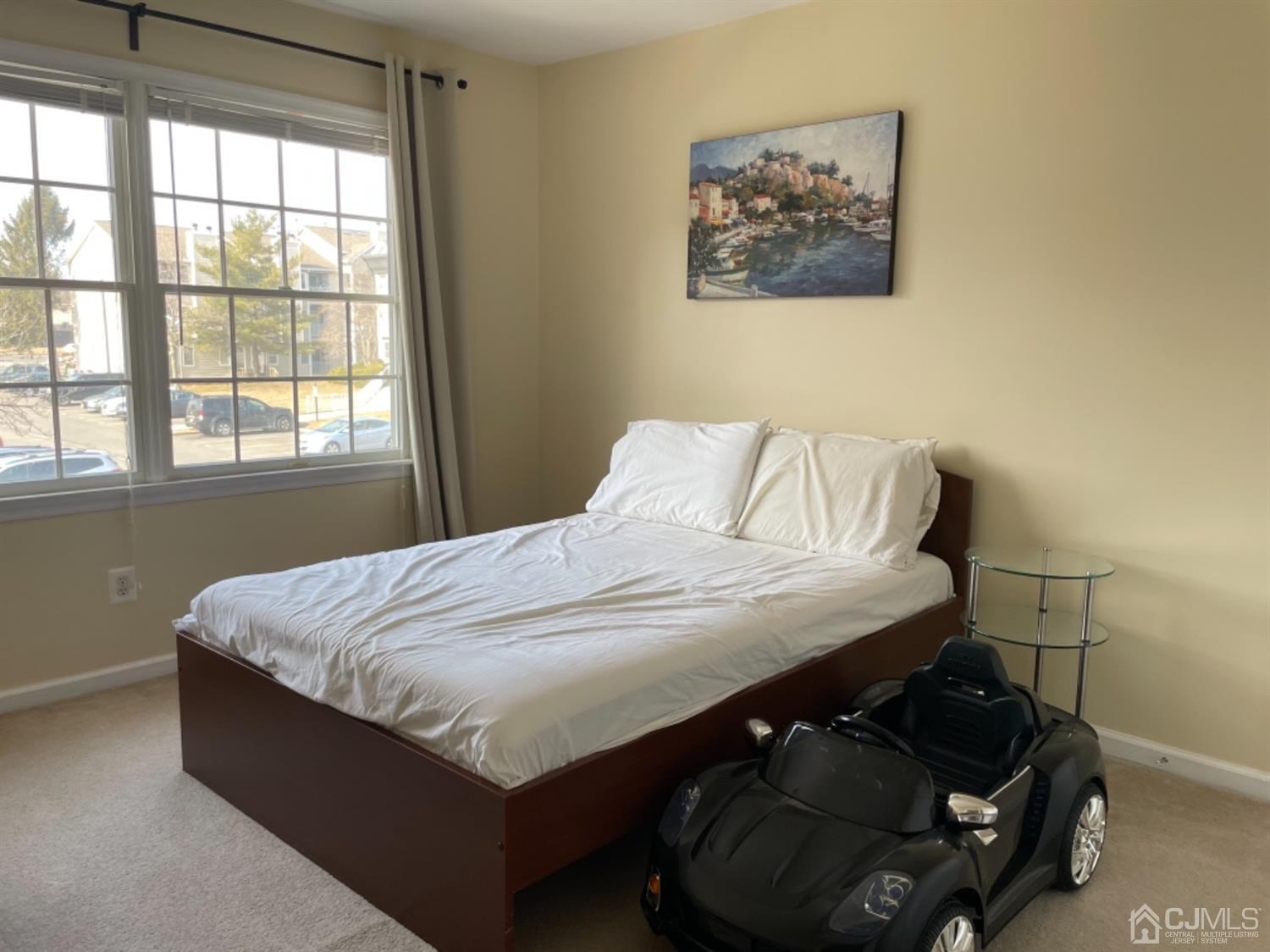 1124 Edpas Road New Brunswick, NJ 08901 - Photo 14 of 24 a bedroom with a bed and window