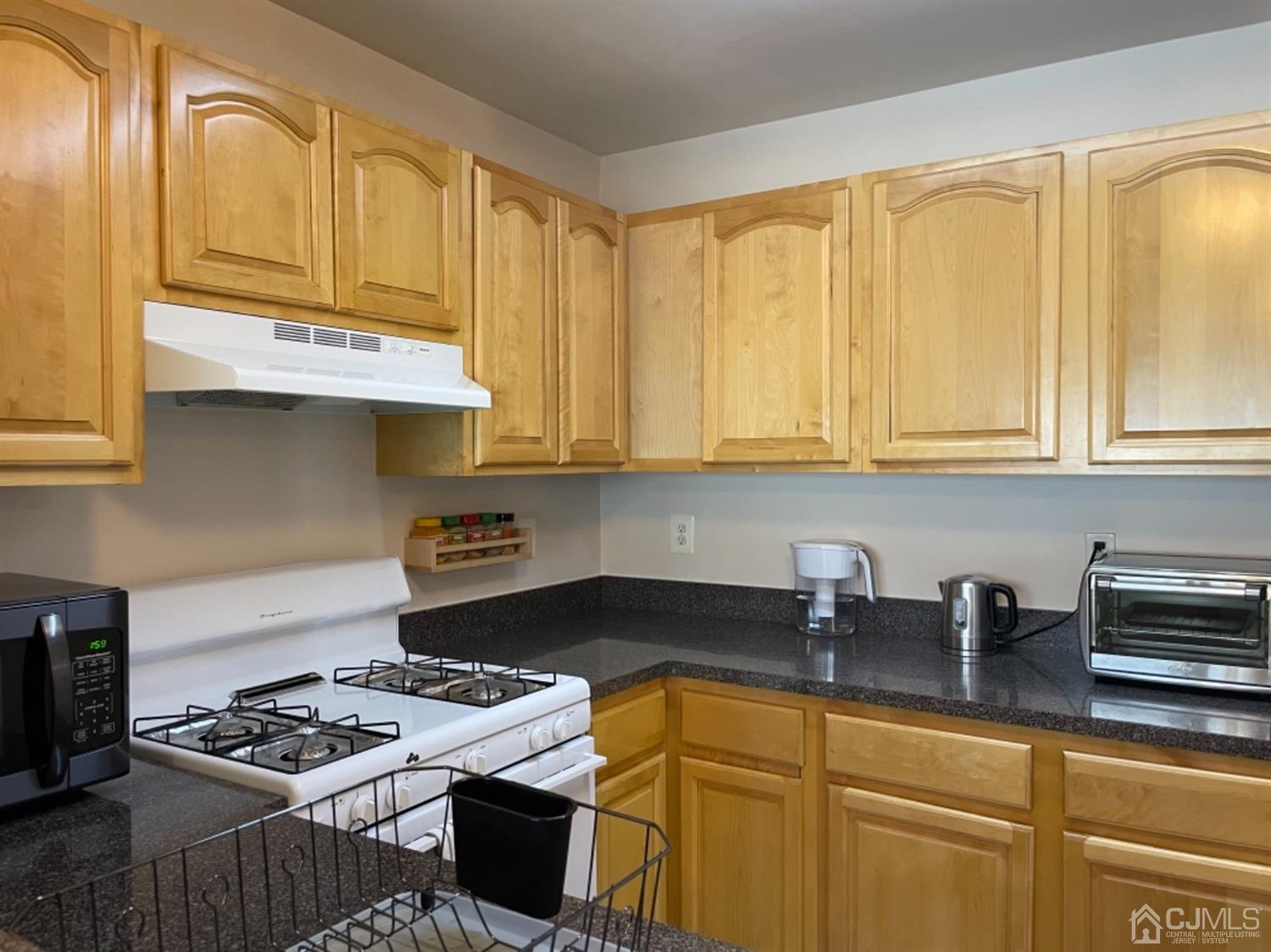 1124 Edpas Road New Brunswick, NJ 08901 - Photo 8 of 24 a kitchen with stainless steel appliances granite countertop a sink stove and cabinets