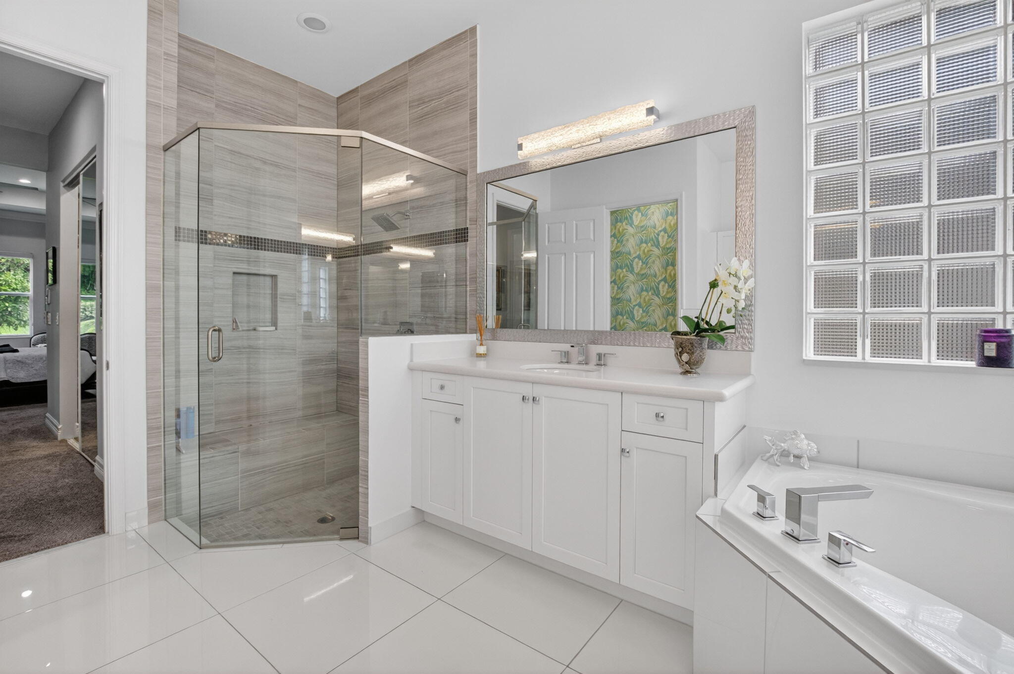 8263 Arabian Range Road Boynton Beach, FL 33473 - Photo 33 of 52 a bathroom with a shower sink and mirror