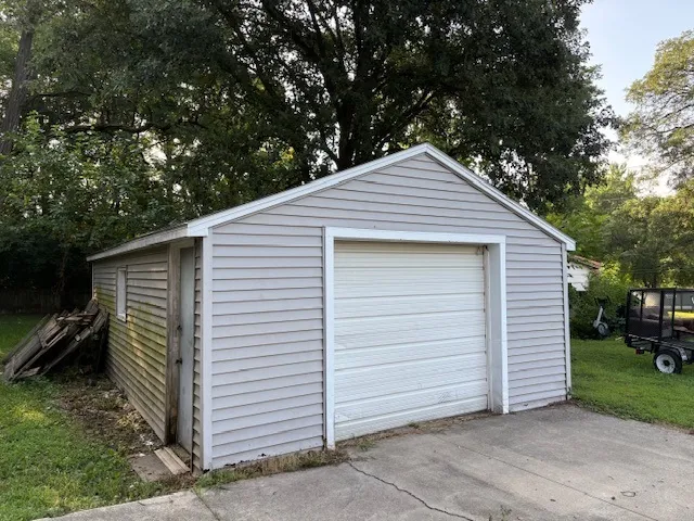 a small white house with a outdoor space