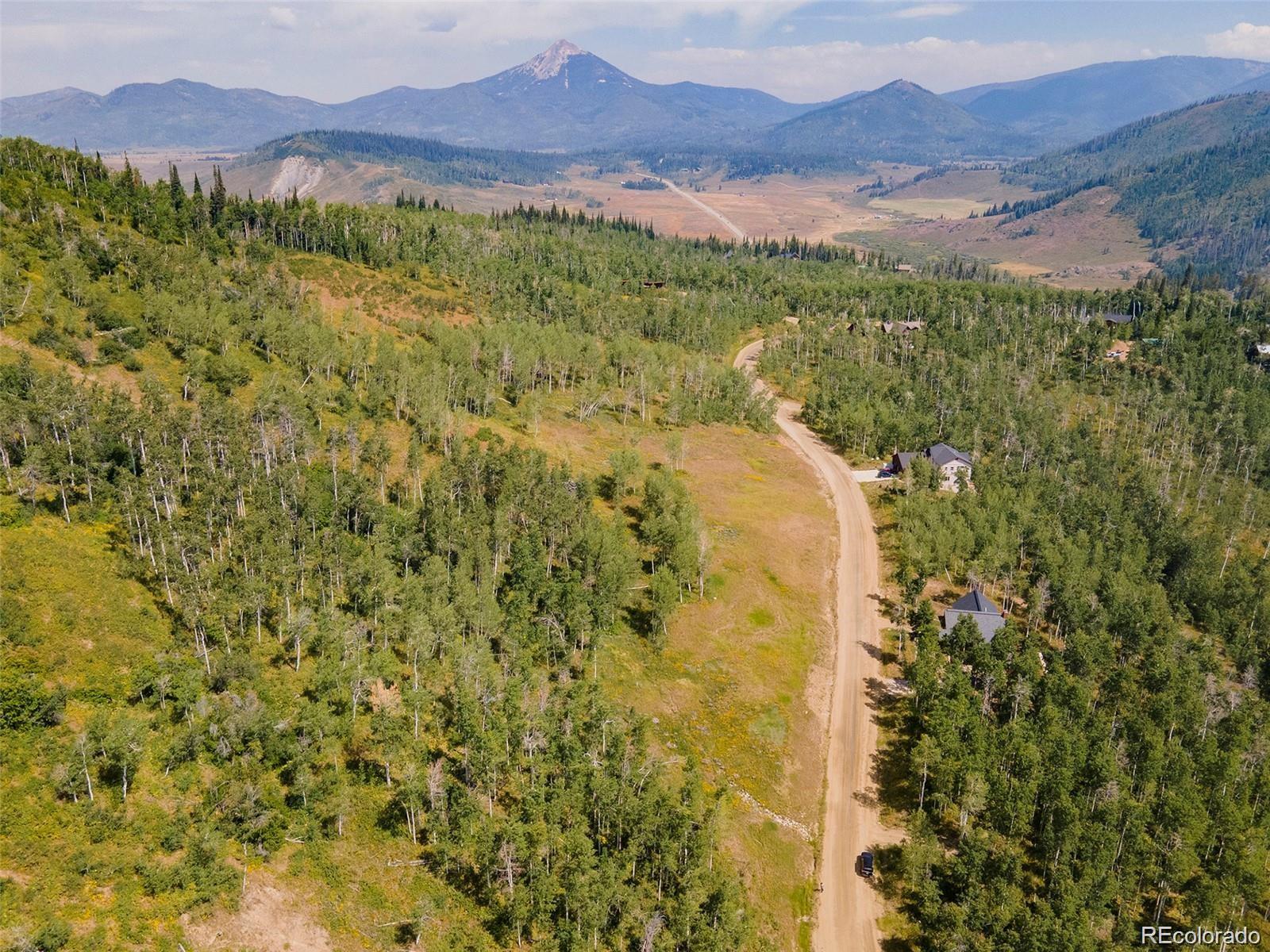 57615 Longfellow Way Clark, CO 80428 - Photo 4 of 20 a view of a lush green hillside and a mountain