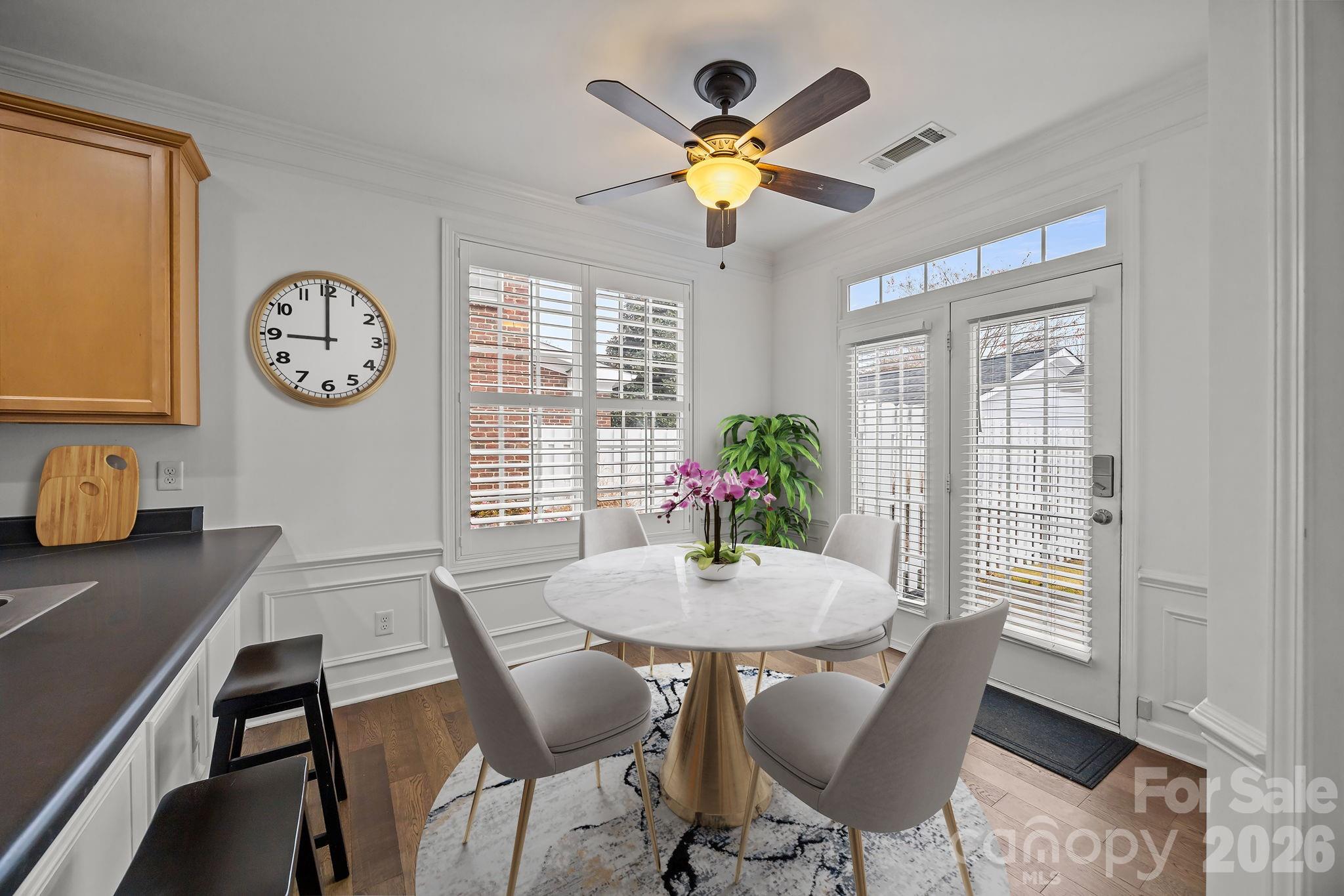 11422 Potters Row Cornelius, NC 28031 - Photo 16 of 46 a view of a dining room with furniture window and wooden floor