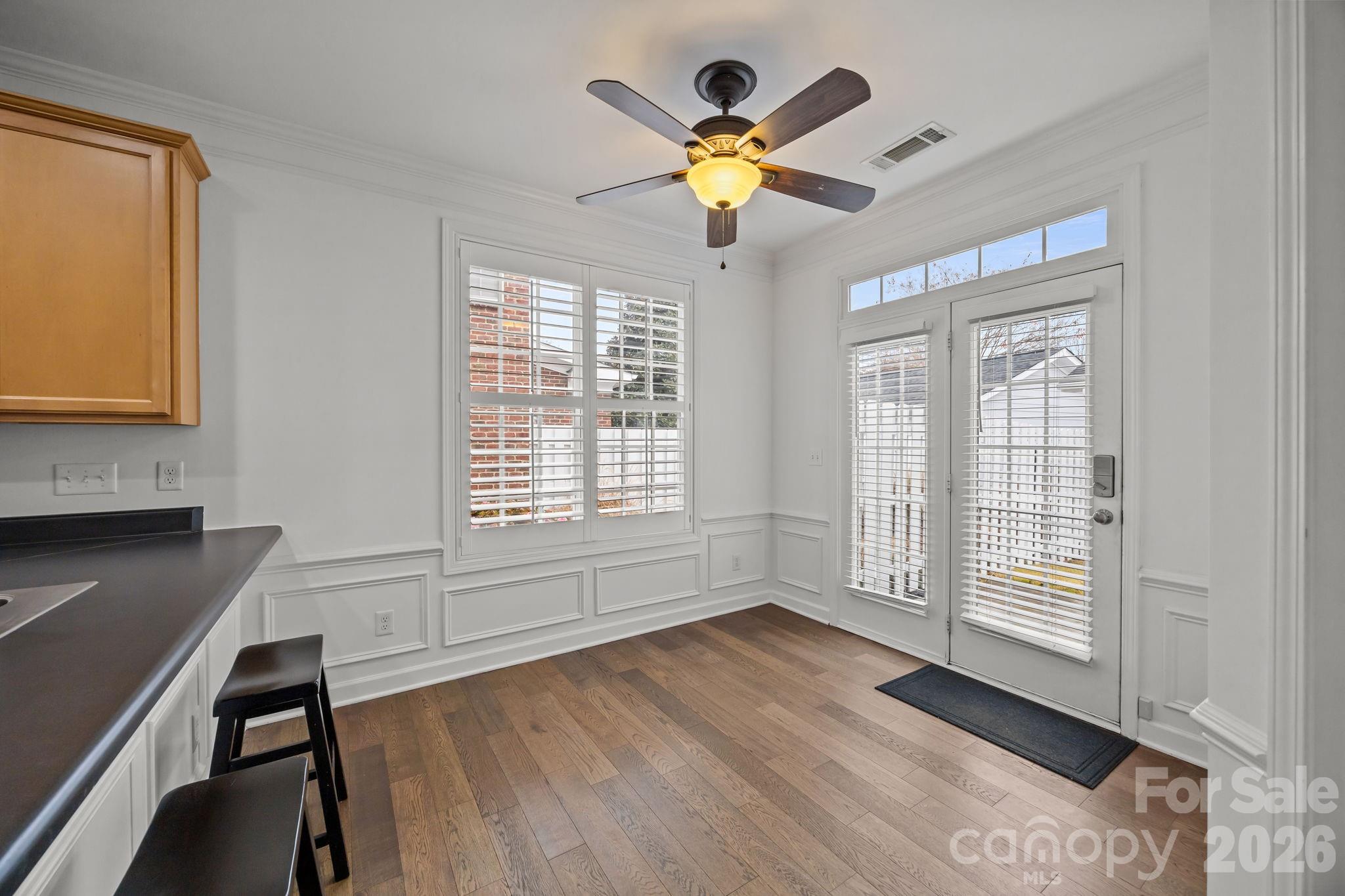 11422 Potters Row Cornelius, NC 28031 - Photo 17 of 46 a view of a livingroom with a window and wooden floor