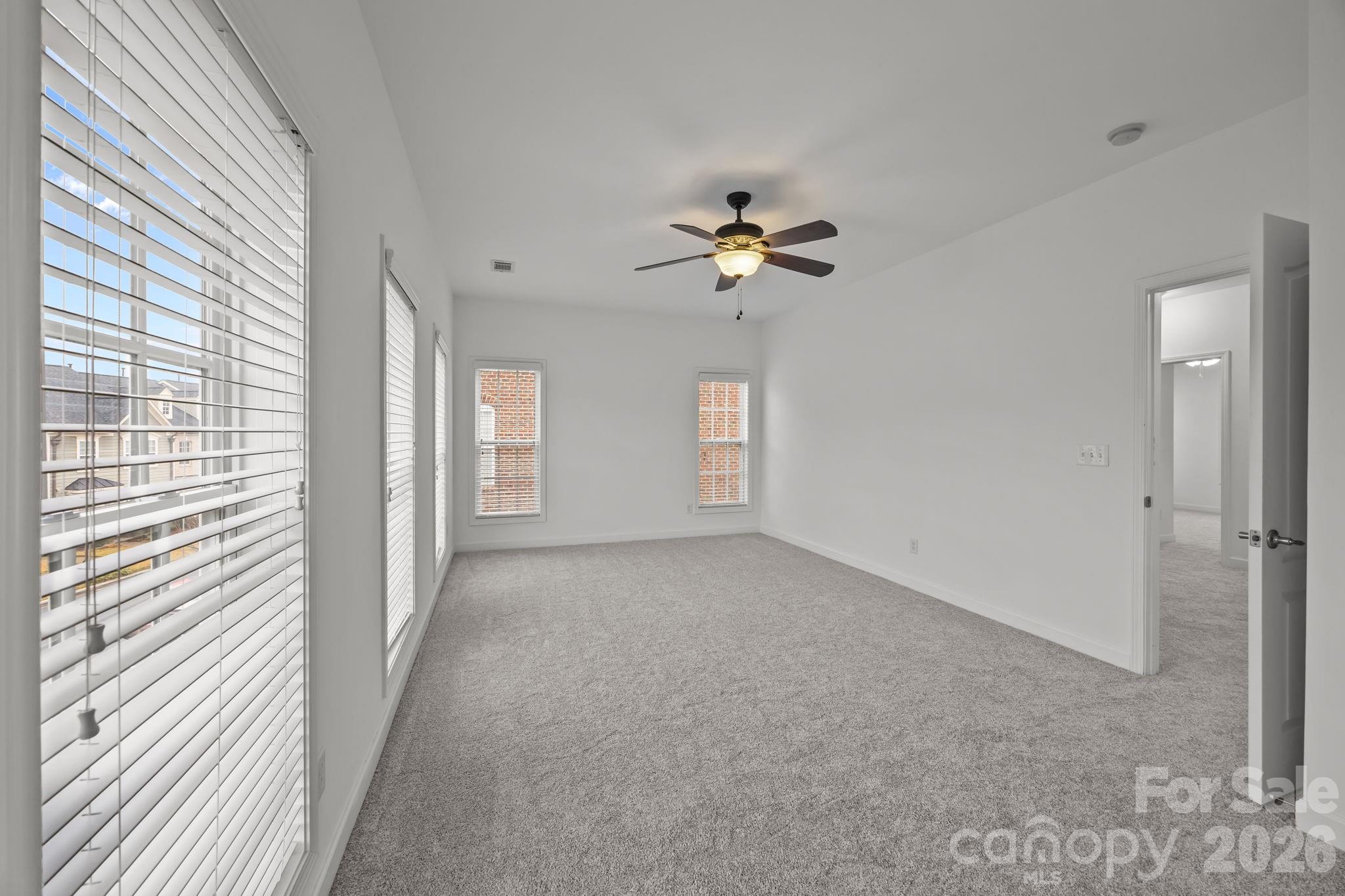 11422 Potters Row Cornelius, NC 28031 - Photo 32 of 46 a view of an empty room with a window