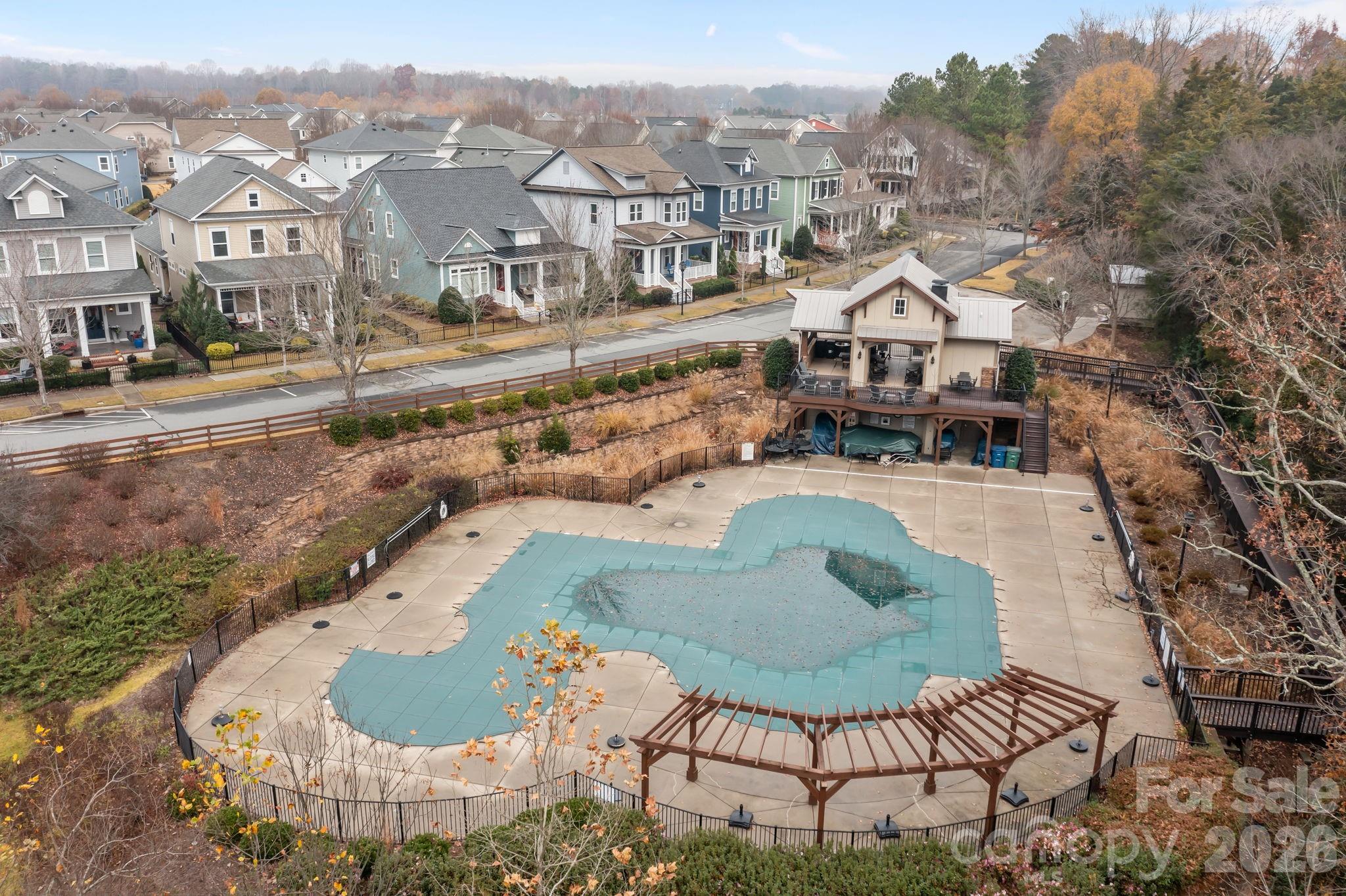 11422 Potters Row Cornelius, NC 28031 - Photo 34 of 46 a view of a swimming pool with a chairs and table in the patio
