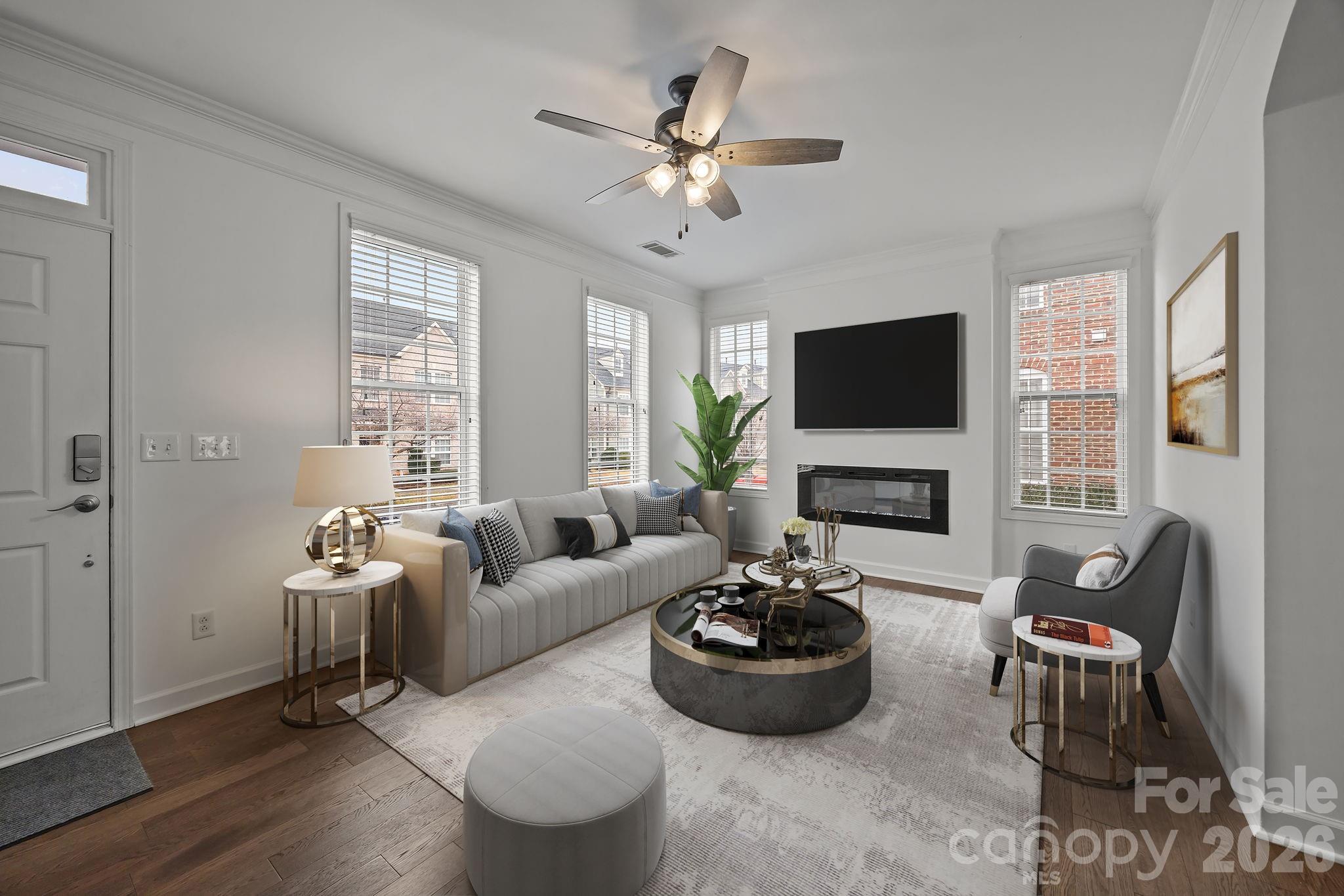 11422 Potters Row Cornelius, NC 28031 - Photo 6 of 46 a living room with furniture a fireplace and a flat screen tv