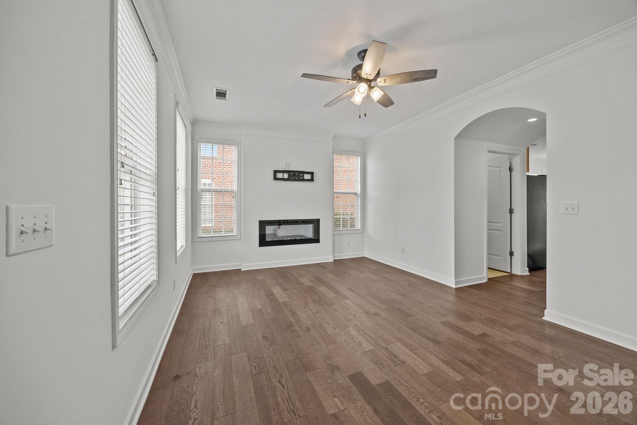 11422 Potters Row Cornelius, NC 28031 - Photo 9 of 46 wooden floor in an empty room with a window