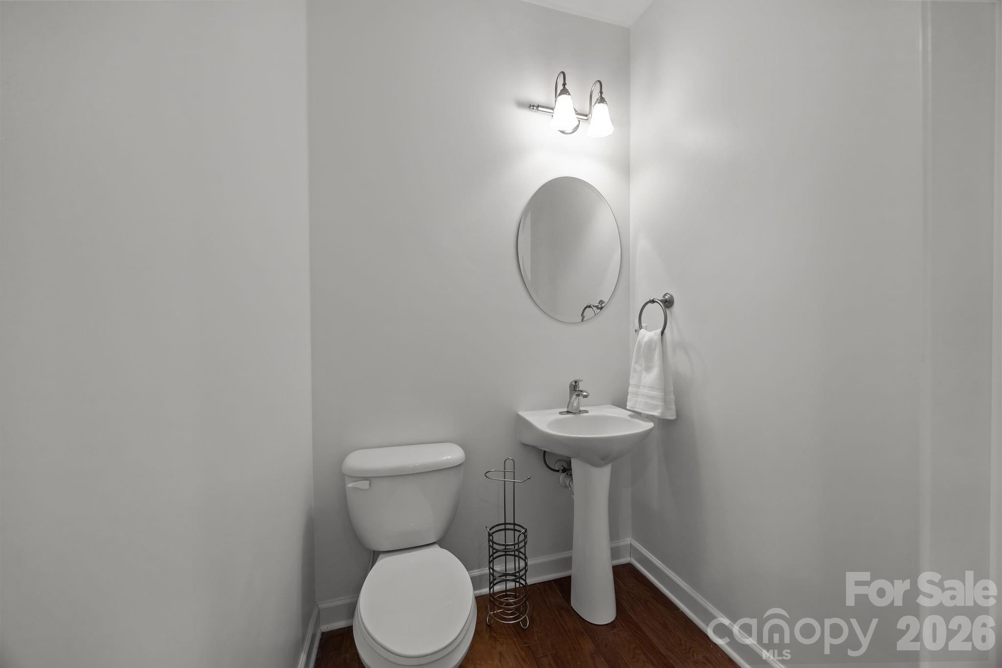 11422 Potters Row Cornelius, NC 28031 - Photo 10 of 46 a bathroom with a toilet a sink and mirror