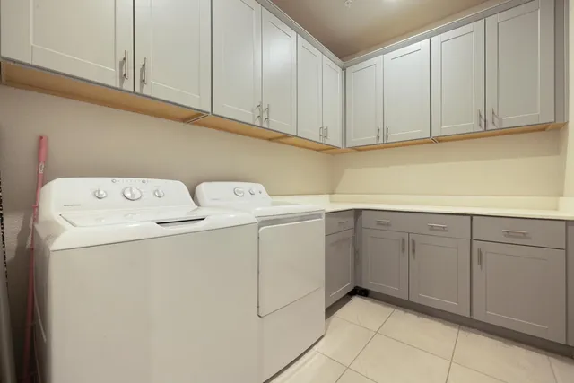 a bedroom with a bed and a television