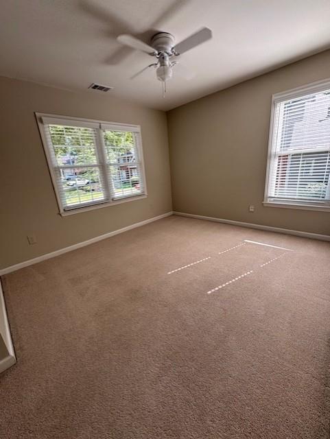 4055 Vista Point Lane Suwanee, GA 30024 - Photo 31 of 42 an empty room with windows and fan