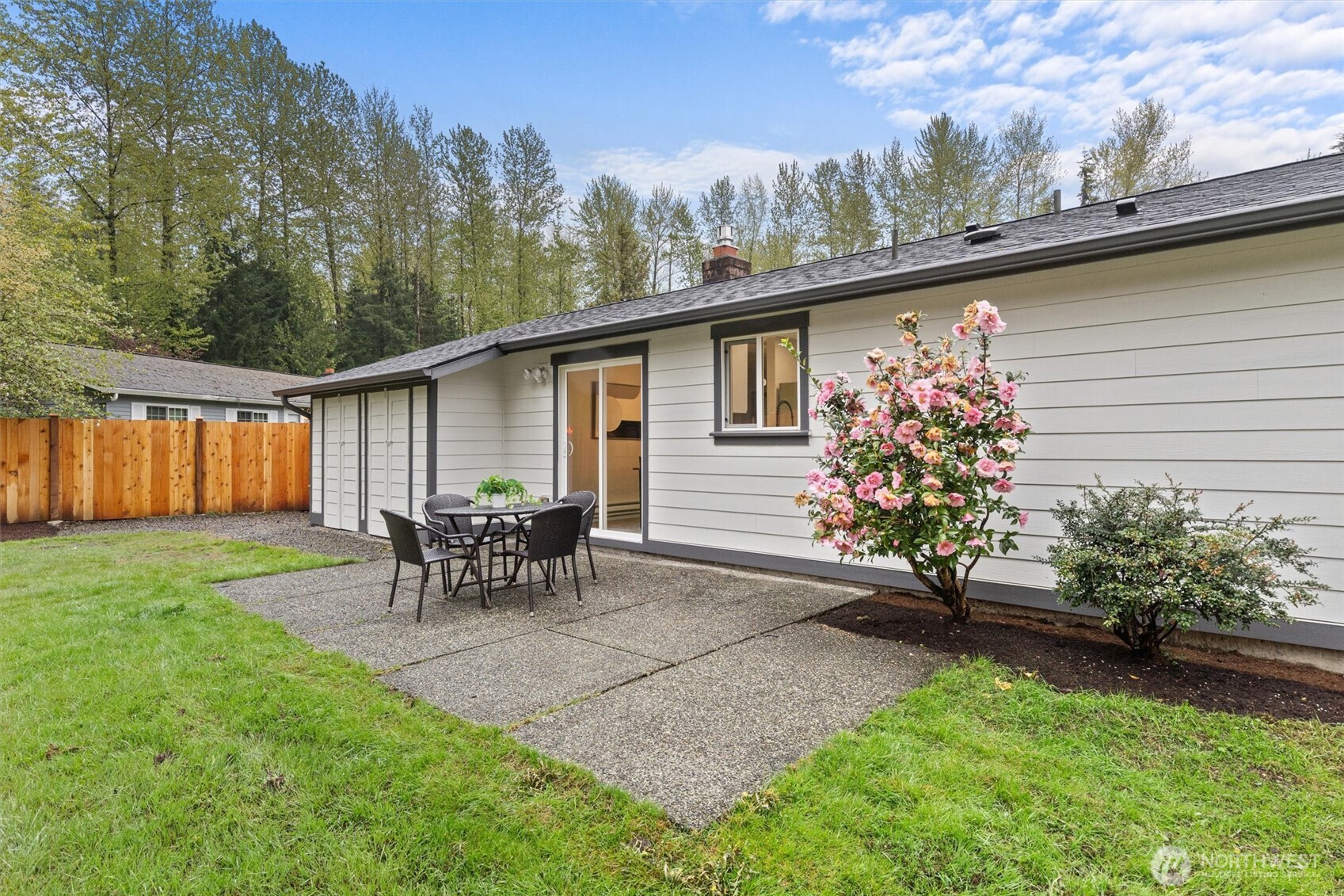 2317 164th Place Southeast Bothell, WA 98012 - Photo 26 of 32 a view of a chair and table in backyard of the house