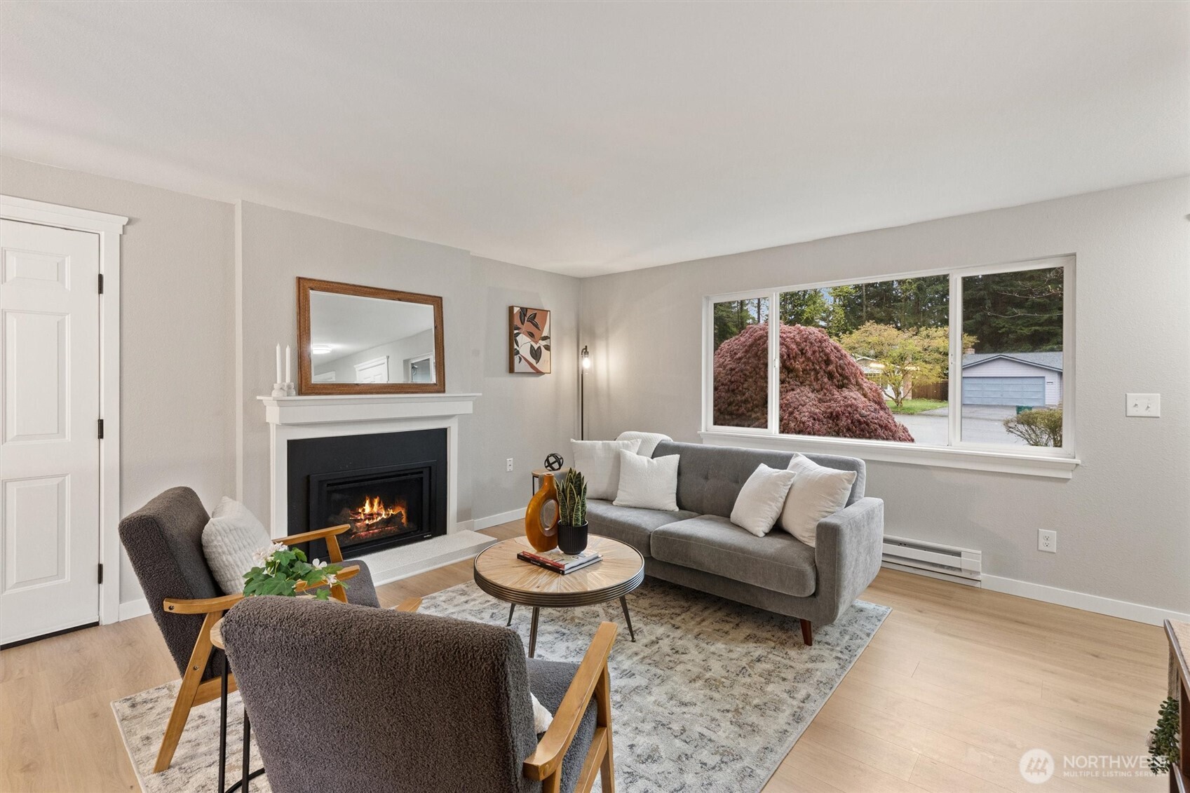 2317 164th Place Southeast Bothell, WA 98012 - Photo 5 of 32 a living room with furniture and a fireplace