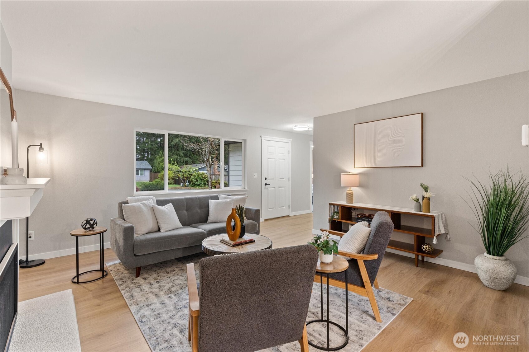 2317 164th Place Southeast Bothell, WA 98012 - Photo 6 of 32 a living room with furniture and a large window