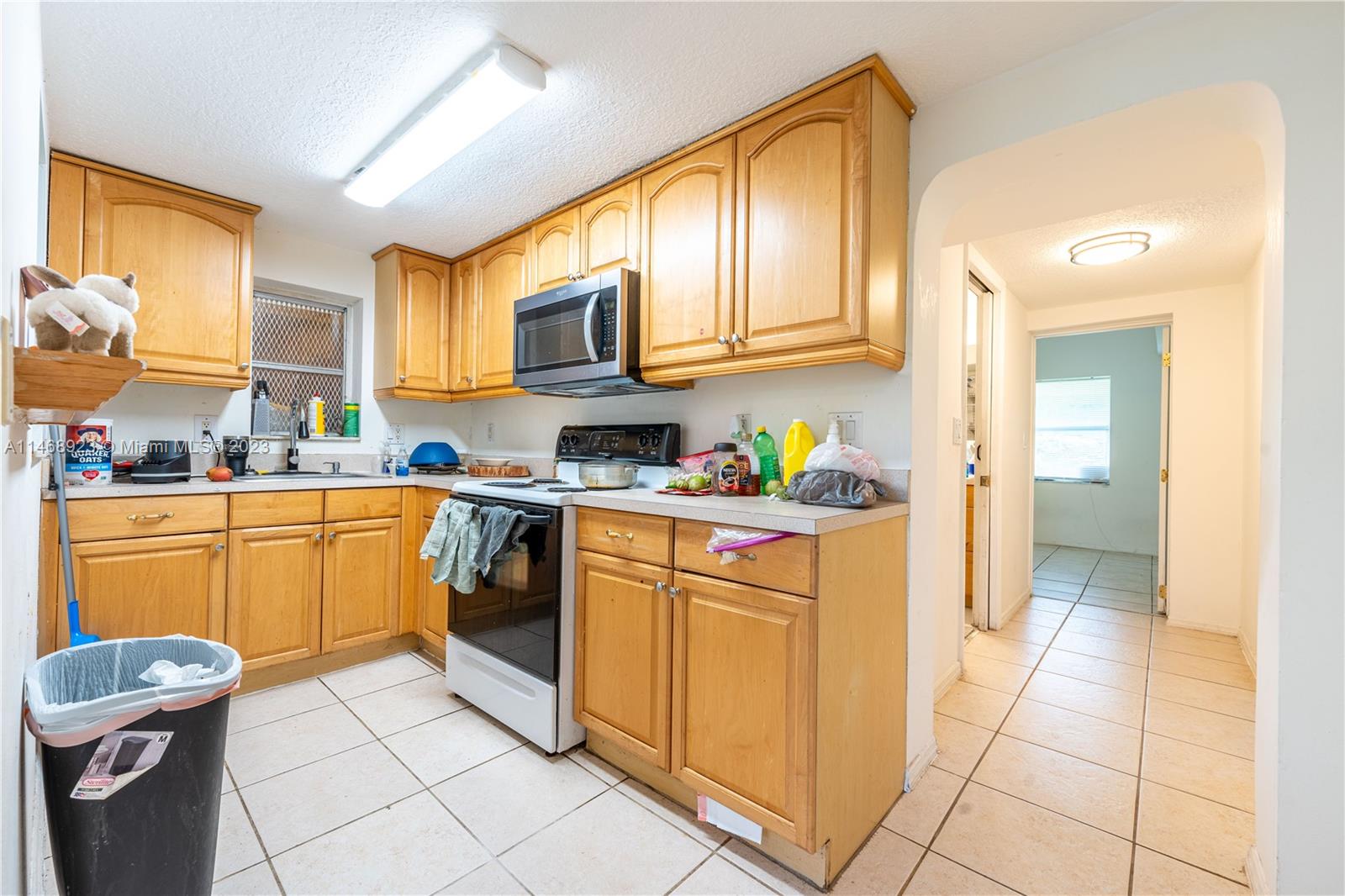 1237 Highview Road Lake Worth, FL 33462 - Photo 3 of 21 a kitchen with stainless steel appliances granite countertop a sink and cabinets