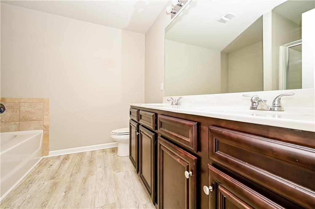 2347 Castle Keep Way Atlanta, GA 30316 - Photo 14 of 15 a bathroom with a sink a toilet and vanity