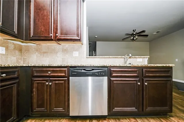 a view of a kitchen with granite countertop