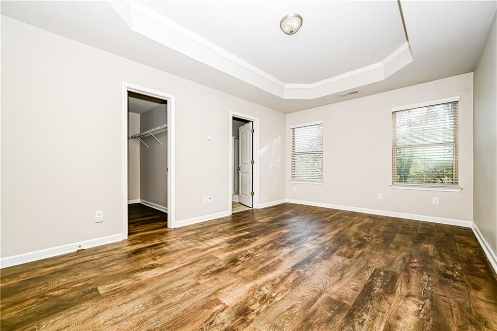 2347 Castle Keep Way Atlanta, GA 30316 - Photo 8 of 15 a view of an empty room with wooden floor and a window