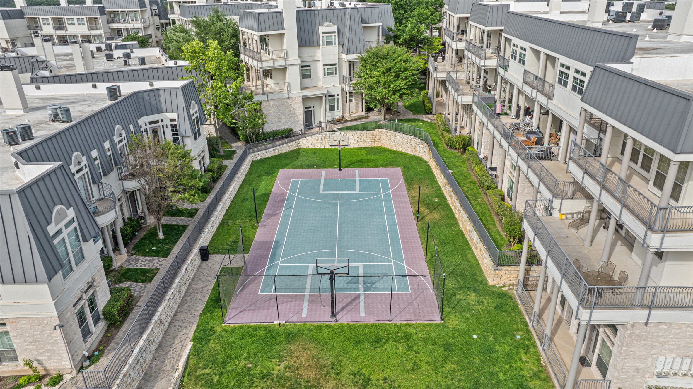 2918 Ranch To Market Road 620, Unit O282 Austin, TX 78734 - Photo 25 of 40 View of sport court with fence, a residential view, and a tennis court