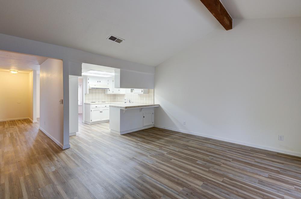 7580 North Angus Street, Unit 103 Fresno, CA 93720 - Photo 11 of 33 a view of kitchen with wooden floor