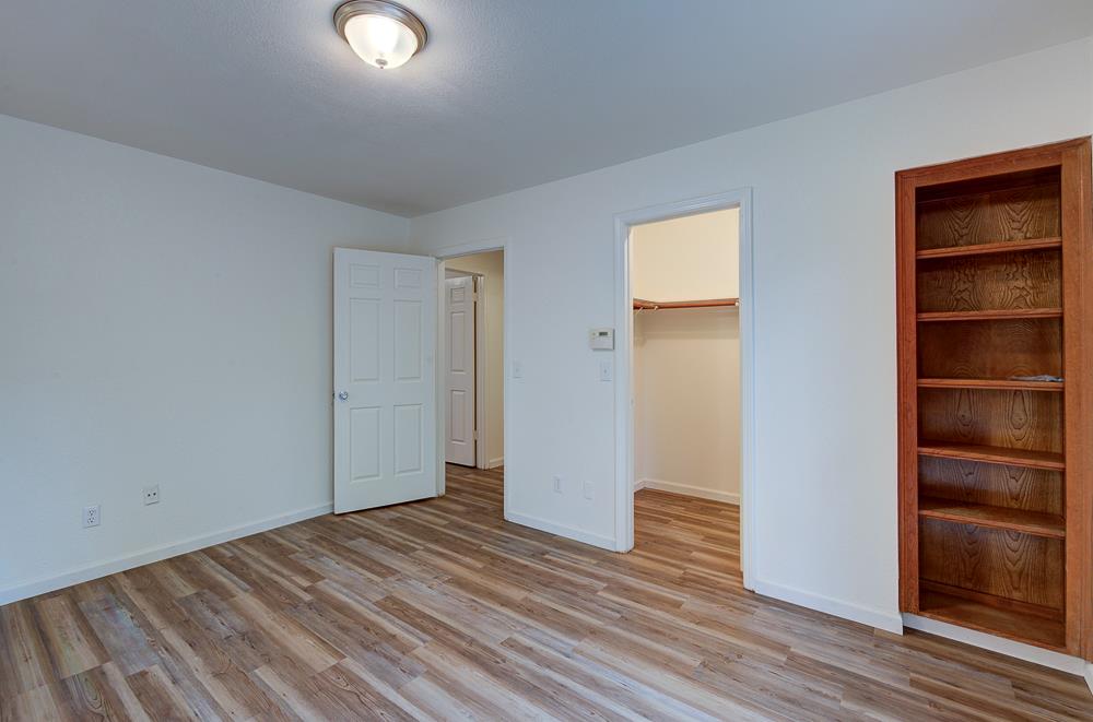 7580 North Angus Street, Unit 103 Fresno, CA 93720 - Photo 20 of 33 a view of empty room with wooden floor