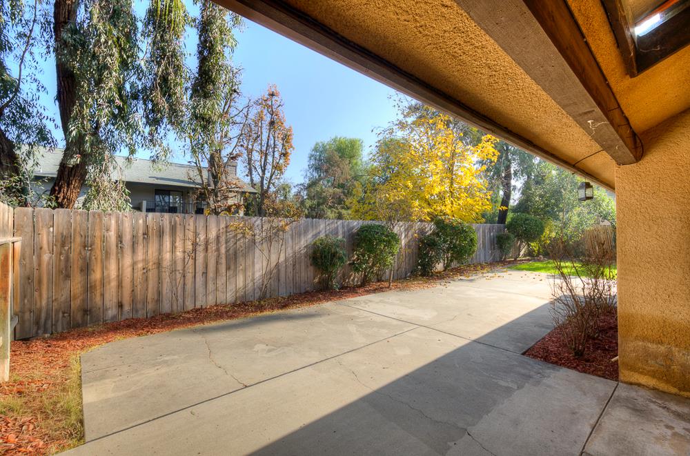 7580 North Angus Street, Unit 103 Fresno, CA 93720 - Photo 27 of 33 a view of a house with a backyard