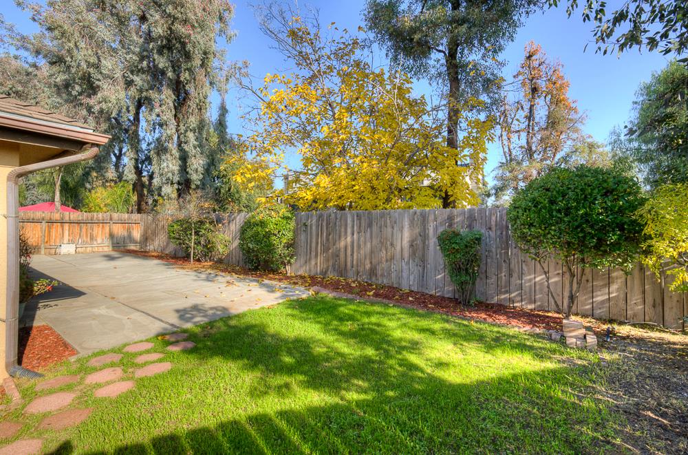 7580 North Angus Street, Unit 103 Fresno, CA 93720 - Photo 30 of 33 a view of backyard with tree