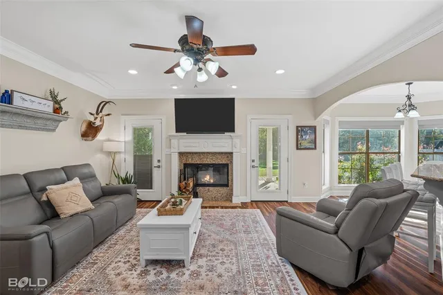 a living room with furniture and a fireplace