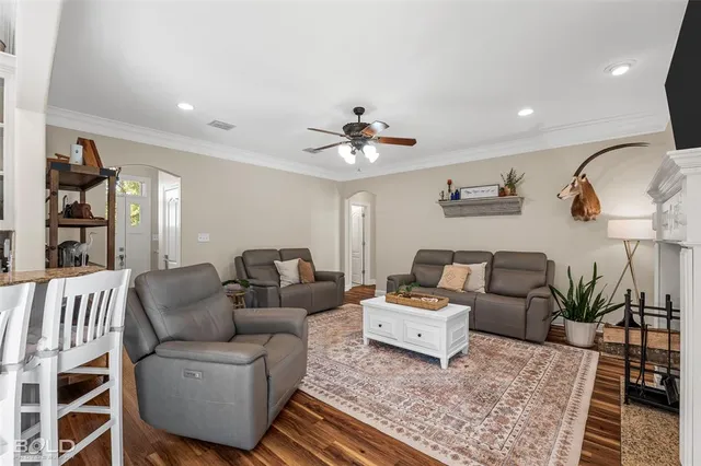 a living room with furniture and a rug