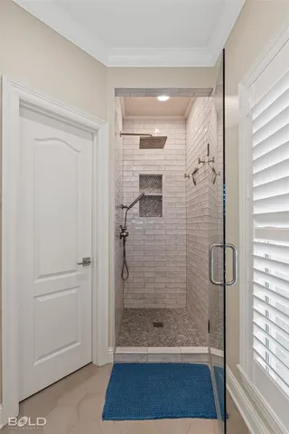 a bathroom with a bathtub and a shower