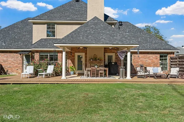 a bedroom with a bed and a television