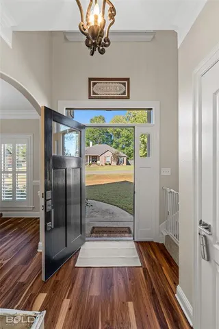 a view of a hallway view with wooden floor and staircase