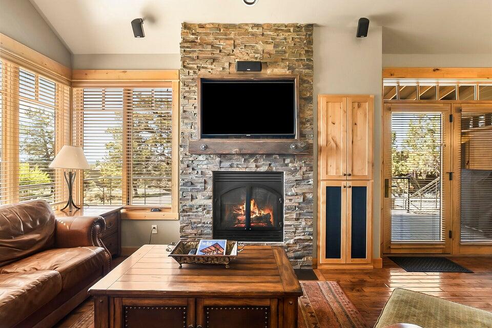 16845 South W Brasada Ranch Road, Unit 23 Powell Butte, OR 97753 - Photo 21 of 47 a living room with furniture a flat screen tv and a fireplace